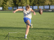 La Center kicker Ben Rembisz goes through a drill at practice at La Center High School on Monday. Rembisz kicked the game-winning field goal on Saturday as the Wildcats won at Mount Baker 25-24.