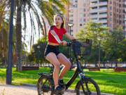 Riding an e-bike in a city park.