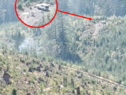 The Clark County Fire Marshal's Office is asking for the public's help identifying the vehicle pictured as a part of the investigation into the cause of the Nakia Creek Fire. The agency said the image was captured at around 3:30 p.m. Oct. 9 on a ridge near Larch Mountain.