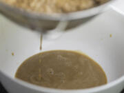 Susanna Foo begins to strain the flavor from the mushrooms to create a Porcini Mushroom and Truffle Sauce.