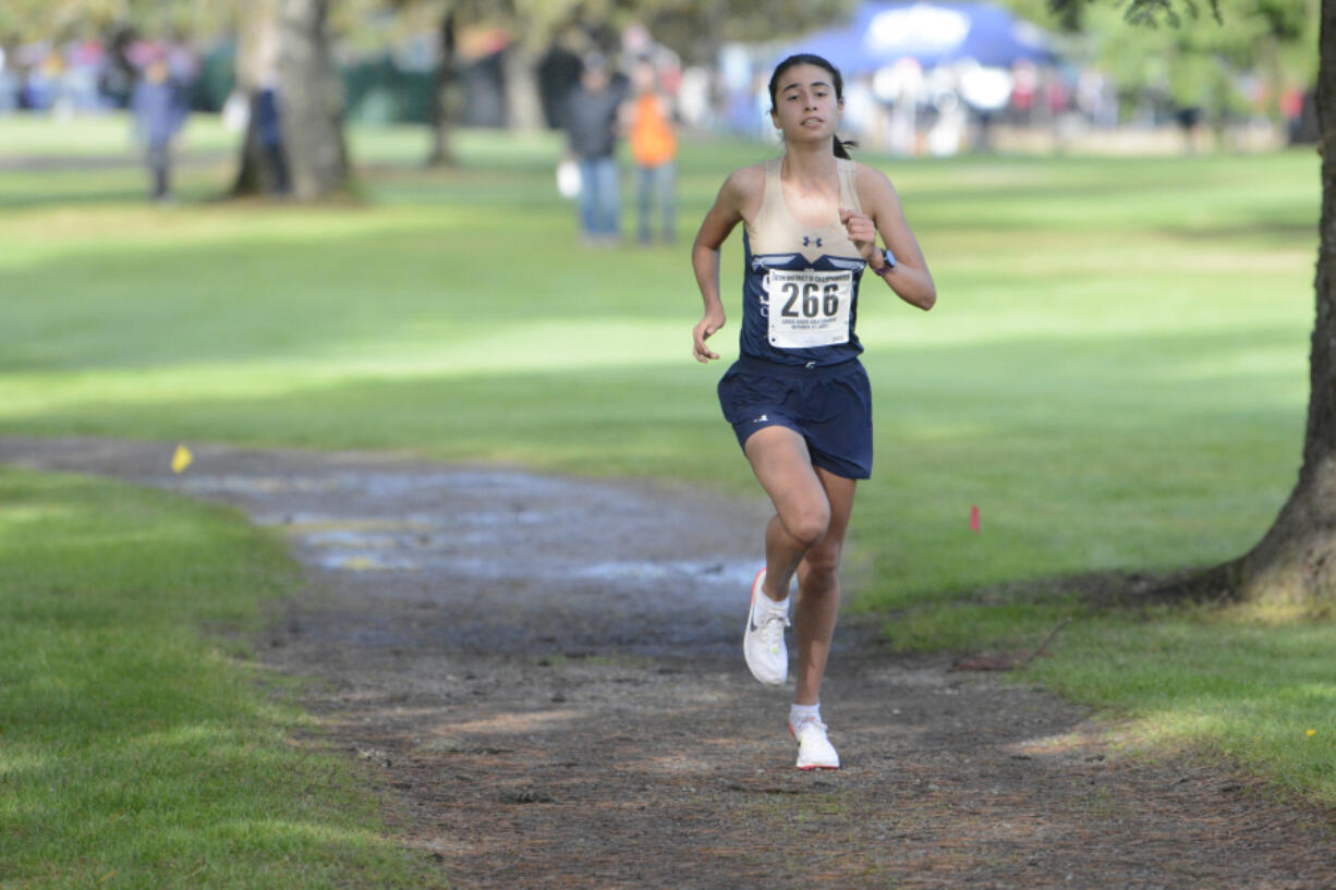 Seton Catholic junior Alexis Leone leads the Class 1A District 4 cross country championships at Lewis River Golf Course east on Woodland on Thursday, Oct. 27, 2022.