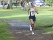 Seton Catholic junior Alexis Leone leads the Class 1A District 4 cross country championships at Lewis River Golf Course east on Woodland on Thursday, Oct. 27, 2022.