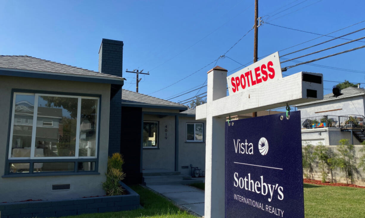 A real estate sign is seen in front of a house for sale in West Los Angeles on Nov. 19, 2020.