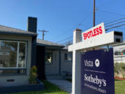 A real estate sign is seen in front of a house for sale in West Los Angeles on Nov. 19, 2020.