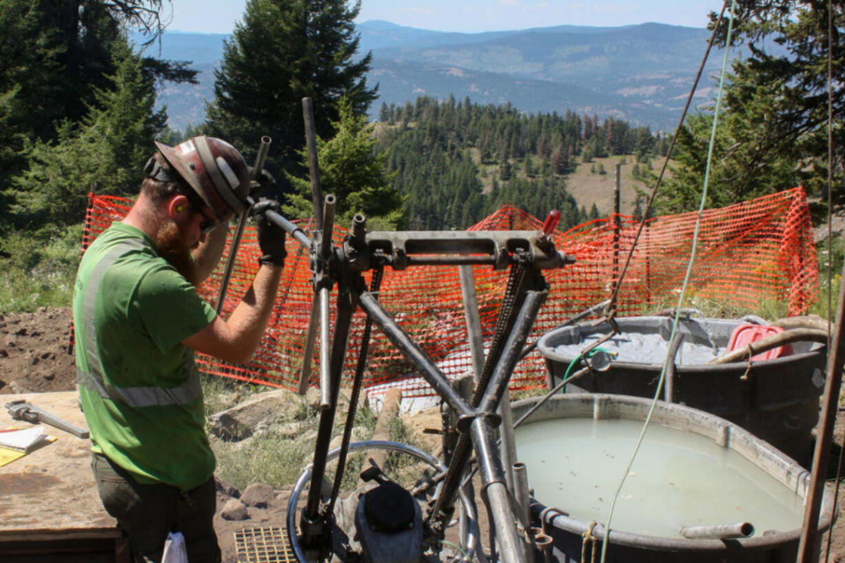 Adamera employee Ethan Heinen operates a drill that collects core samples from the earth.