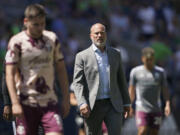 Portland Timbers head coach Giovanni Savarese walks off the pitch with his team after the first half of an MLS soccer match against the Seattle Sounders, Saturday, July 9, 2022, in Seattle. (AP Photo/Ted S.