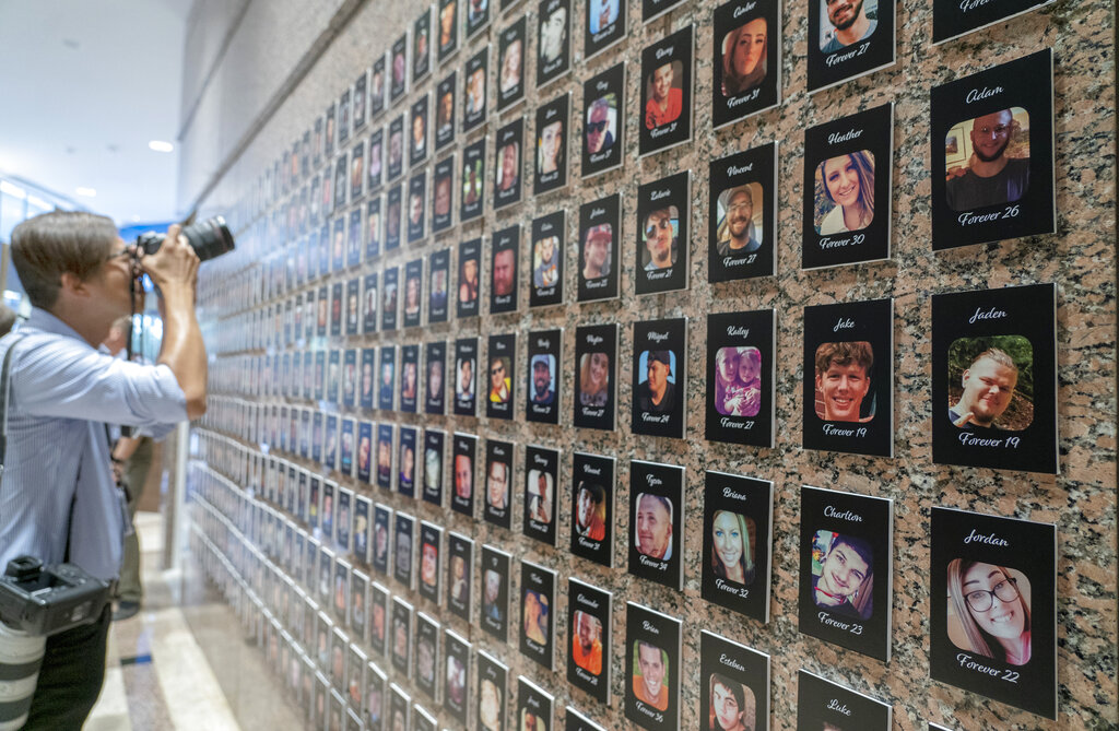 FILE—A photojournalist takes pictures of the exhibits on "The Faces of Fentanyl" at DEA headquarters before a press event at DEA headquarters, Arlington, Va., in this file photo from Sept. 27, 2022. Heading into key elections, there have been assertions that the drug might be handed out like Halloween candy, something the U.S. Drug Enforcement Agency's head has said isn't true.