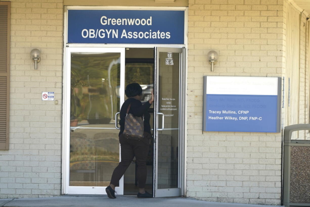 An individual enters the Greenwood OB/GYN Associates clinic across the street from the Greenwood Leflore Hospital in Greenwood, Miss., Oct. 21, 2022. (AP Photo/Rogelio V.