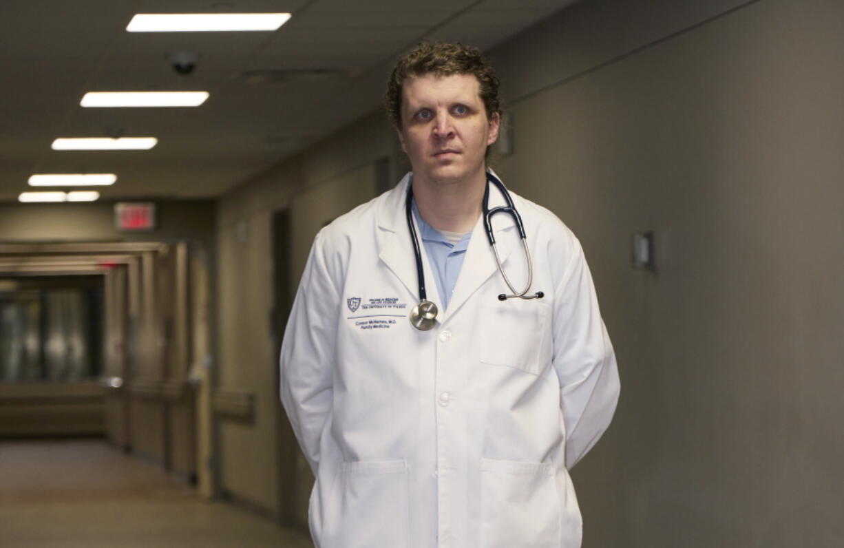 Dr. Connor McNamee, a third-year family medicine resident at the University of Toledo Medical Center, poses at the medical center, Tuesday, Oct. 18, 2022, in Toledo, Ohio. Students in obstetrics-gynecology and family medicine are facing tough choices about where to advance their training in a landscape where legal access to abortion varies from state to state. McNamee began exploring abortion training outside Ohio last summer. A state law bans most abortions after cardiac activity is detected, but a judge has blocked it while a challenge proceeds.