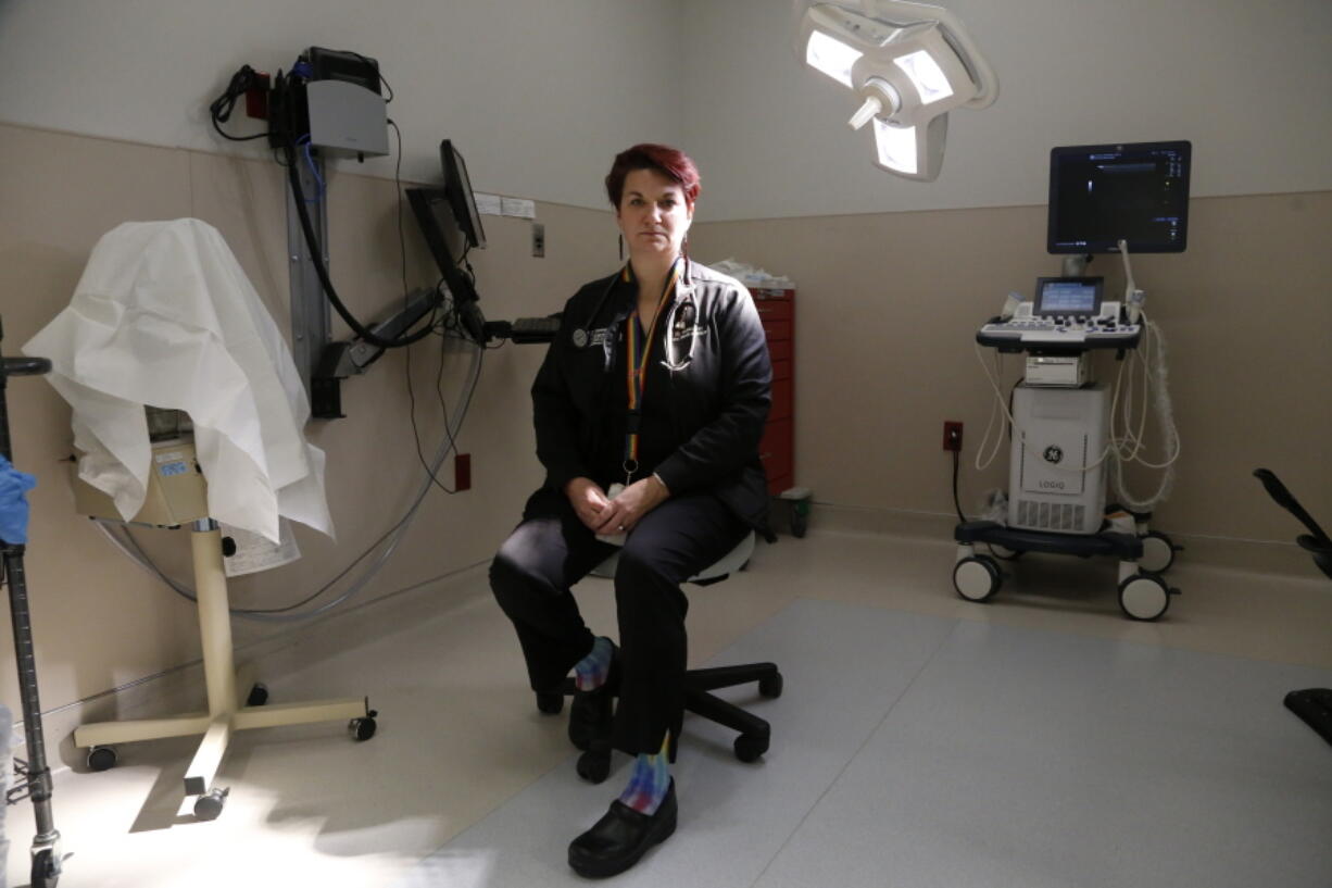 FILE - Dr. Colleen McNicholas, chief medical officer at Planned Parenthood of the St. Louis Region and Southwest Missouri, sits in a surgical room on April 11, 2022, at the Planned Parenthood clinic in Fairview Heights, Ill. Midwestern Planned Parenthood officials on Monday, Oct. 3, 2022, announced plans for a mobile abortion clinic -- a 37-foot RV that will stay in Illinois but travel to near the border of adjoining states that have banned the procedure since the Supreme Court overturned Roe v. Wade earlier this year.