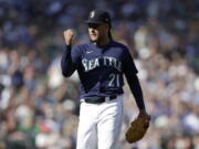 Seattle Mariners starting pitcher Luis Castillo pumps his fist after pitching against the Oakland Athletics in the fifth inning of a baseball game, Saturday, Oct. 1, 2022, in Seattle.