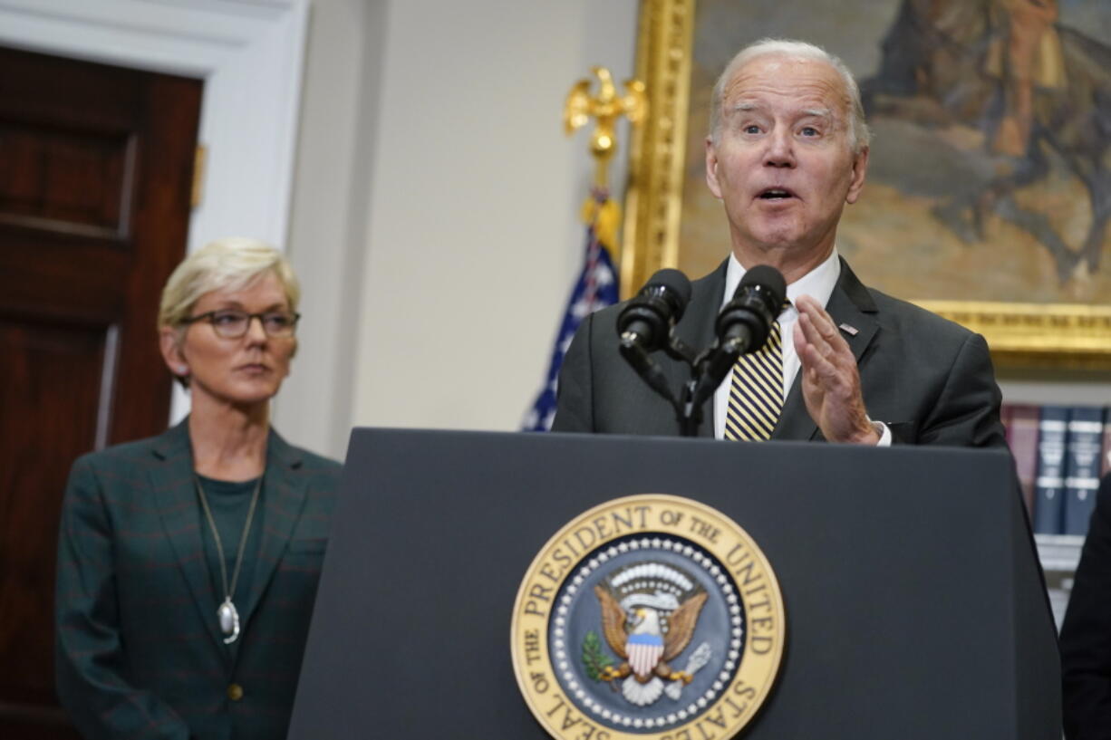 Energy Secretary Jennifer Granholm listens as President Joe Biden speaks about energy and the Strategic Petroleum Reserve during an event in the Roosevelt Room of the White House, Wednesday, Oct. 19, 2022, in Washington.