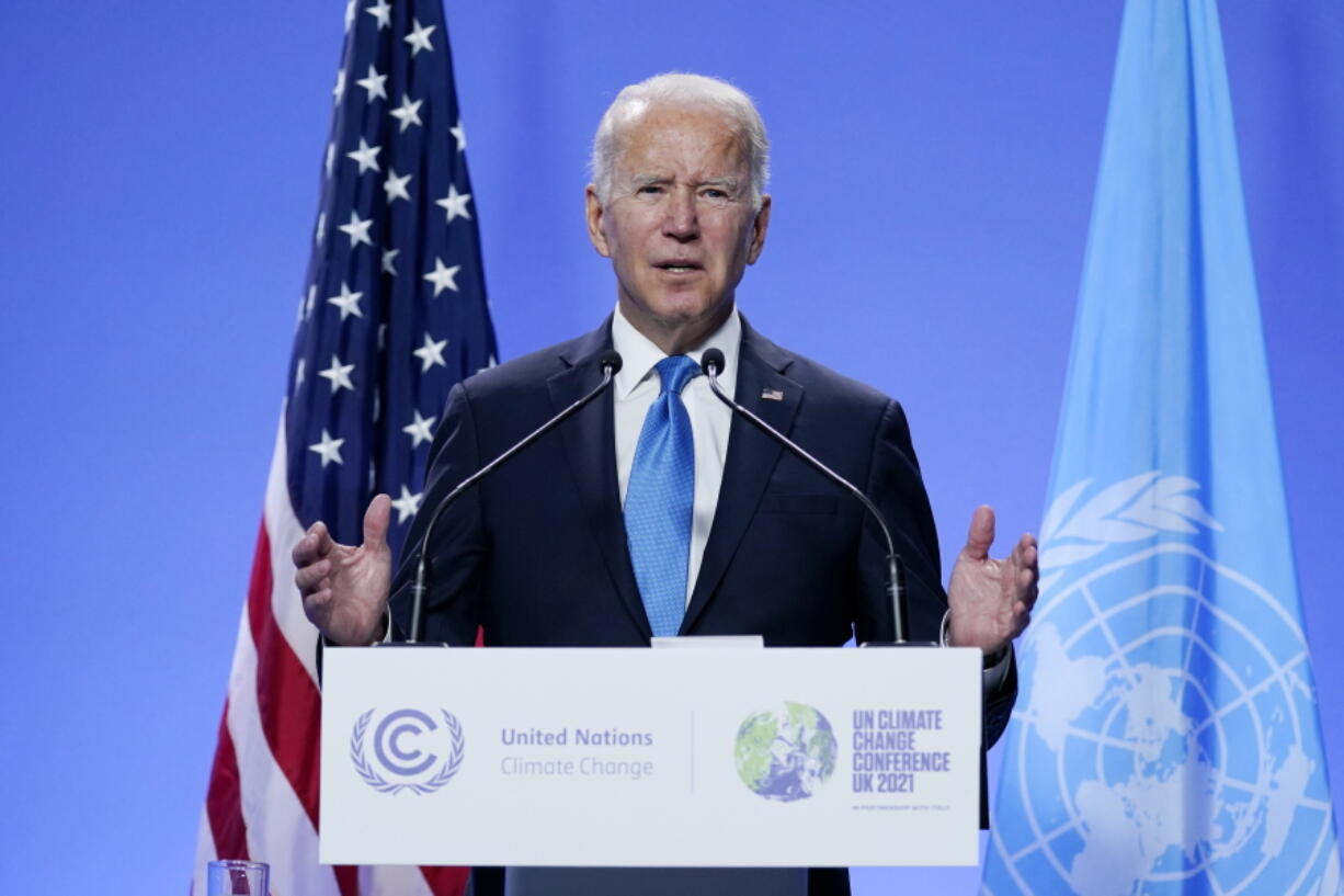 FILE - President Joe Biden speaks during a news conference at the COP26 U.N. Climate Summit, Nov. 2, 2021, in Glasgow, Scotland. Shortly after Biden took office, he issued what was widely hailed as a landmark executive order calling for the U.S. government to address the impact of climate change on migration. Since then, however, the Biden administration has done little more than study the idea.