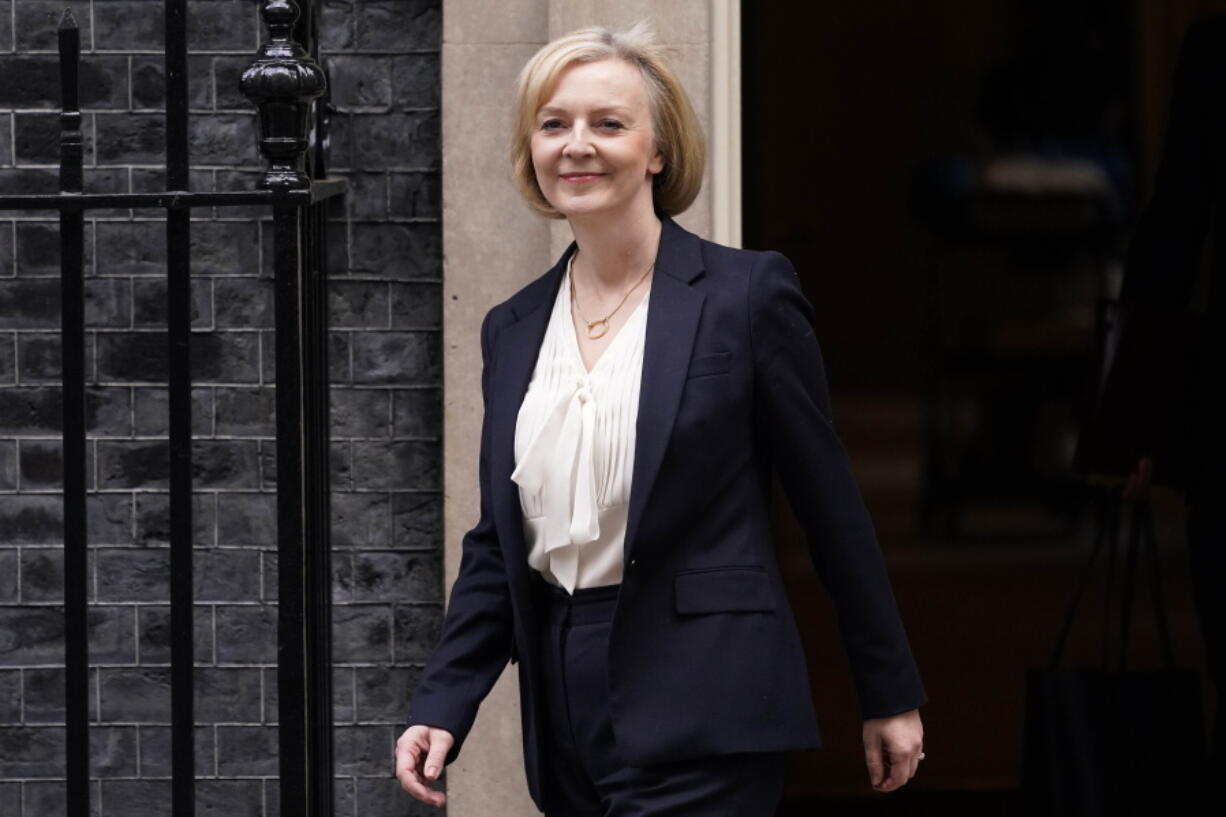 Britain's Prime Minister Liz Truss leaves 10 Downing Street to attend the weekly Prime Ministers' Questions session in parliament in London, Wednesday, Oct. 19, 2022.