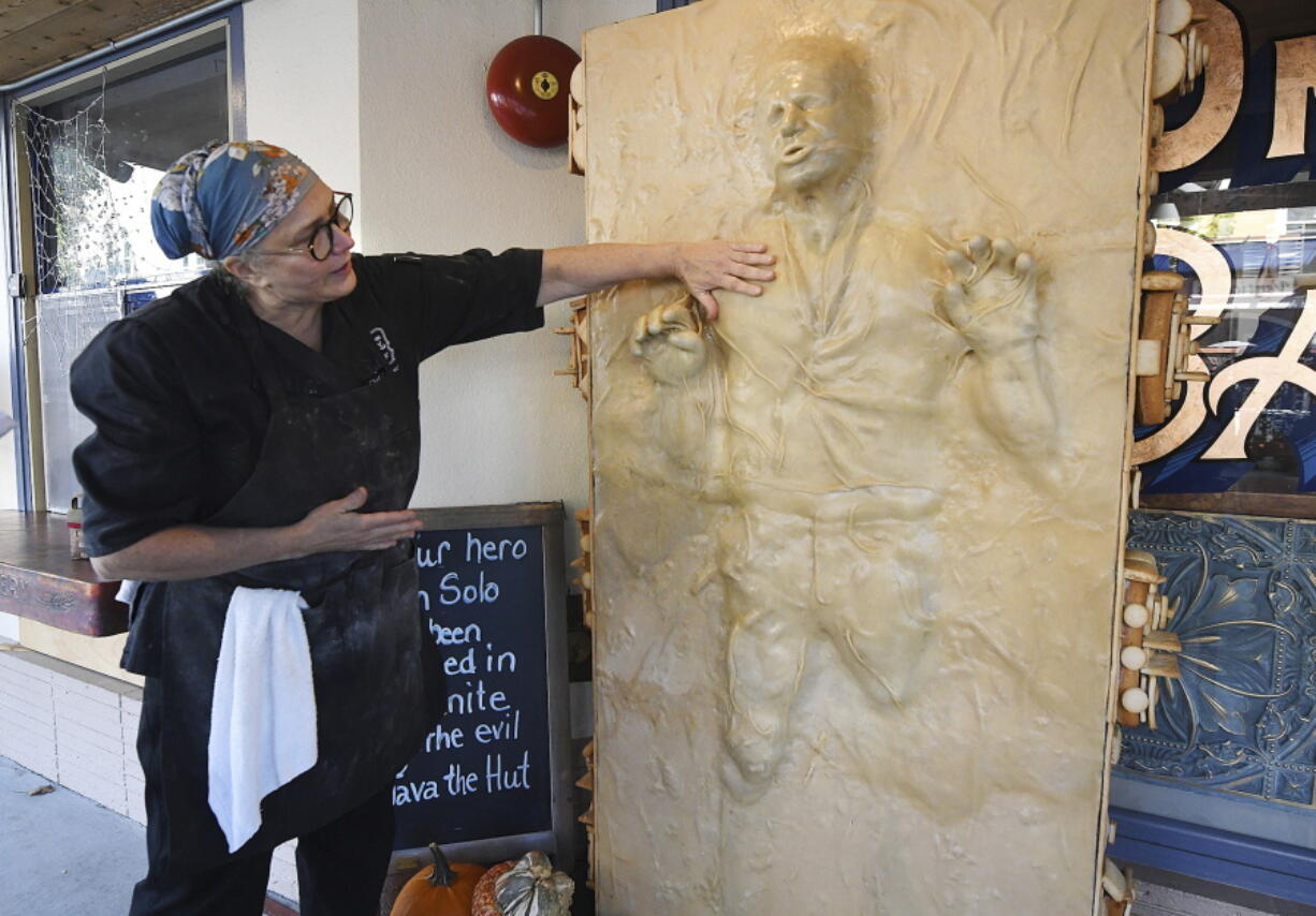 Catherine Pervan, with Our House Bakery in Benicia, Calif., talks about creating the life-sized Han Solo on Oct. 13, 2022  The piece is the bakery's entry in the downtown Benicia scarecrow contest.