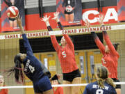 Skyview's Emem Ntekpere (4) makes a play at the next as Camas' Sami Tyler (5) and Kendall Mairs defend during the Papermakers' win over Skyview at Camas High School on Thursday, Oct. 27, 2022.