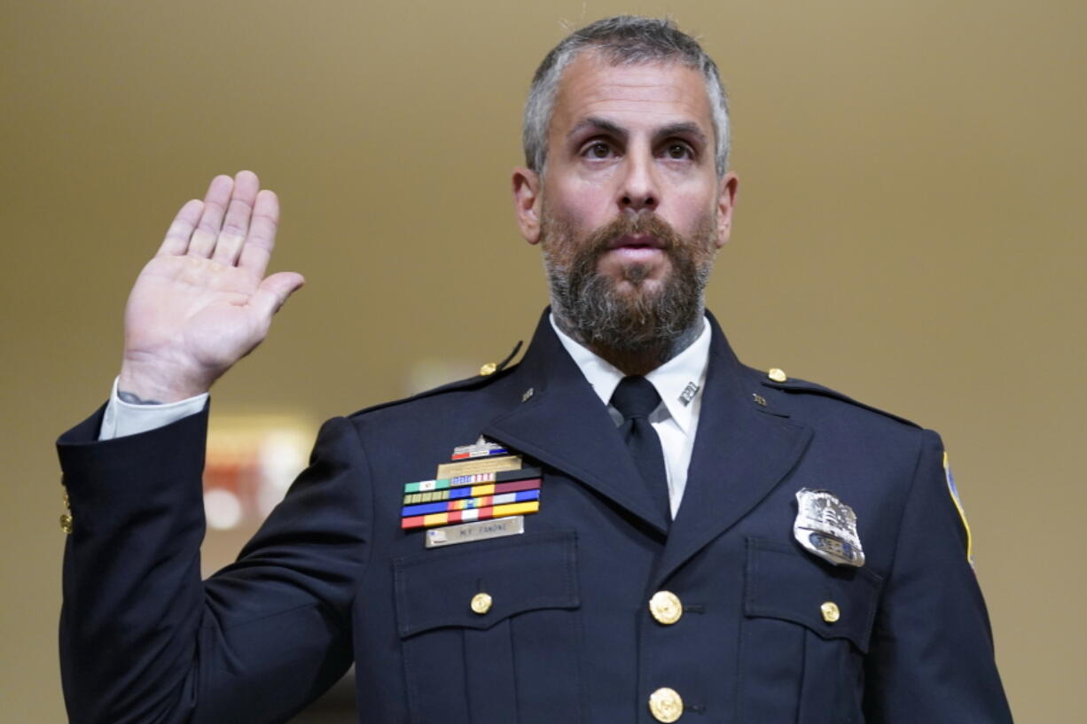 FILE - Washington Metropolitan Police Department officer Michael Fanone is sworn in to testify to the House select committee hearing on the Jan. 6 attack on Capitol Hill in Washington, July 27, 2021.