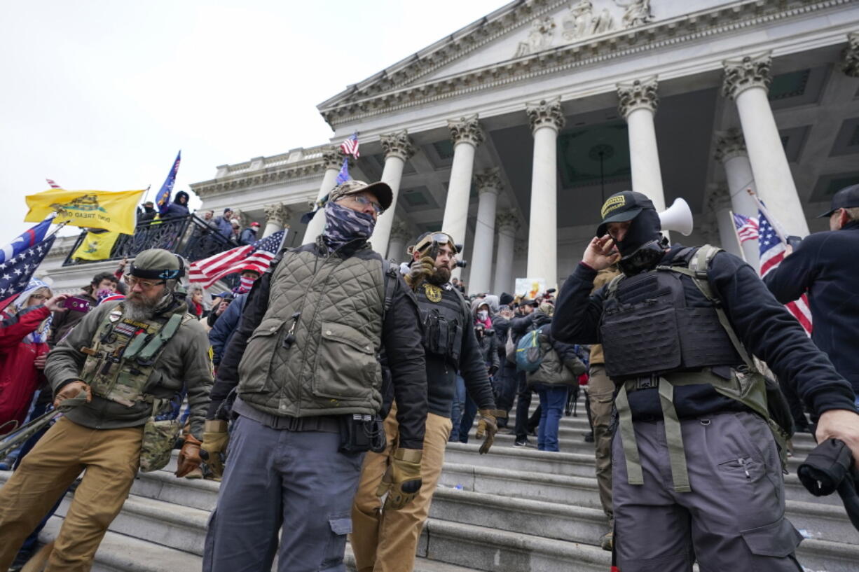 FILE - Members of the Oath Keepers on the East Front of the U.S. Capitol on Jan. 6, 2021, in Washington. A Florida man who stormed the U.S. Capitol with other members of the far-right Oath Keepers testified On Monday, Oct. 31, 2022, that he believed they were participating in a historic "Bastille-type event" reminiscent of the French Revolution.