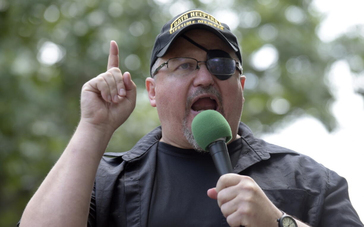 FILE - Stewart Rhodes, founder of the Oath Keepers, speaks during a rally outside the White House in Washington, June 25, 2017. In his trial in the violent Jan. 6, 2021 attack on the U.S. Capitol, attorneys for the leader of the Oath Keepers extremist group will mount an unusual defense with former President Donald Trump at its center. Defense attorneys are poised to argue that Rhodes can't be found guilty of seditious conspiracy because everything he did was in preparation for orders he anticipated coming down from the Republican president.