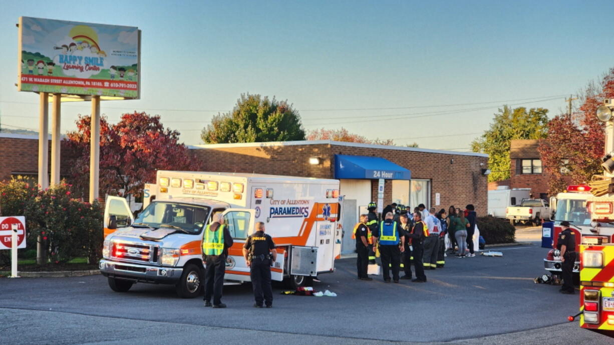 Emergency responders work on the scene of a carbon monoxide leak at a day care center in Allentown, Pa. on Tuesday, Oct. 11, 2022.