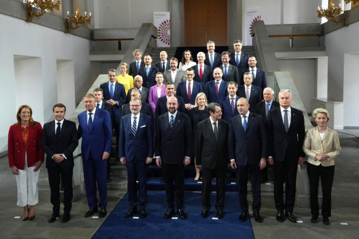 European Union leaders pose for a group photo during an EU Summit at Prague Castle in Prague, Czech Republic, Friday, Oct 7, 2022. European Union leaders converged on Prague Castle Friday to try to bridge significant differences over a natural gas price cap as winter approaches and Russia's war on Ukraine fuels a major energy crisis. Front row left, to right, European Parliament President Roberta Metsola, French President Emmanuel Macron, Romania's President Klaus Werner Ioannis, Czech Republic's Prime Minister Petr Fiala, European Council President Charles Michel, Cypriot President Nicos Anastasiades, Bulgaria's President Rumen Radev, Lithuania's President Gitanas Nauseda and European Commission President Ursula von der Leyen.