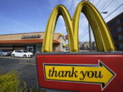 FILE - An exit sign is shown at a McDonald's restaurant in Pittsburgh on Saturday, April 23, 2022. McDonald's reported better-than-expected sales in the third quarter, Thursday, Oct. 27, 2022,  as it charged higher prices and drew in customers with its Camp McDonald's promotion.  (AP Photo/Gene J.