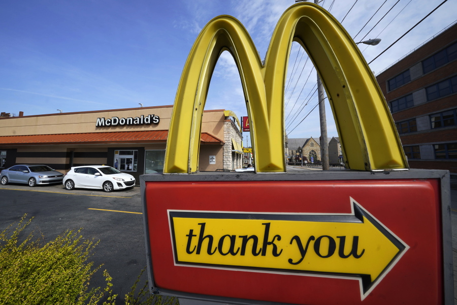 FILE - An exit sign is shown at a McDonald's restaurant in Pittsburgh on Saturday, April 23, 2022. McDonald's reported better-than-expected sales in the third quarter, Thursday, Oct. 27, 2022,  as it charged higher prices and drew in customers with its Camp McDonald's promotion.  (AP Photo/Gene J.