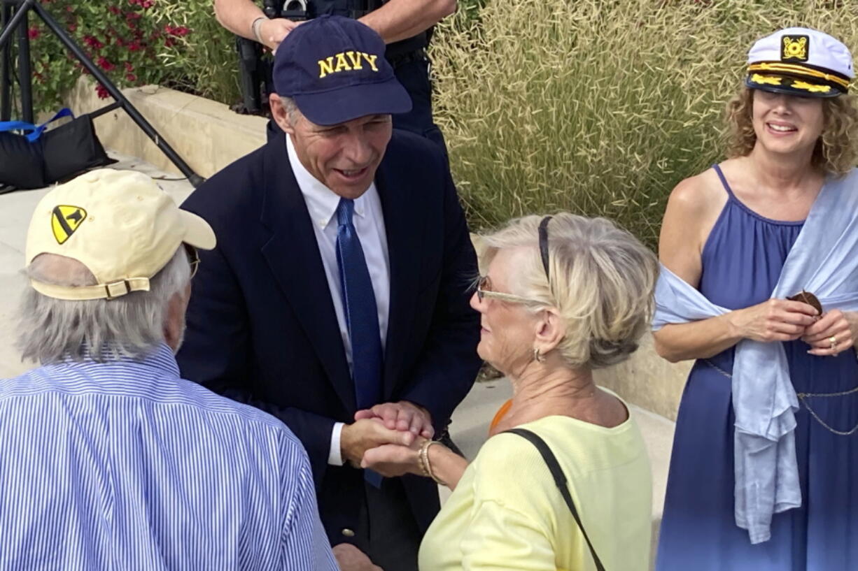 Iowa Democratic U.S. Senate candidate Michael Franken greets supporters with his wife Jordan, right, after a rally in West Des Moines, Iowa, Saturday, Oct. 1, 2022. Franken is facing an uphill final month in his challenge of seven-term Republican Sen. Chuck Grassley.