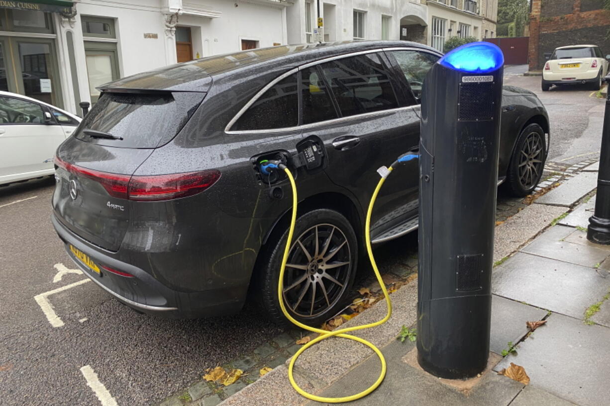 An electric vehicle charges at a public fast-charging station in London on Oct. 20, 2022. London and some other European cities are far ahead of the U.S. when it comes to making fast-charging accessible for renters who can't plug in their EVs at home in a private garage. In the United States, public charging for renters and others without private garages is a barrier to EV adoption.