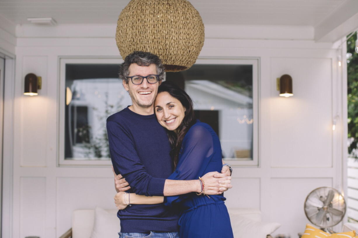 This photo provided by ALS patient Brian Wallach shows him and his wife, Sandra Abrevaya, at their home in Chicago on May 2021. Wallach, who formed I AM ALS with Abrevaya after being diagnosed with ALS in 2017, spent years working on legislation with congressional staffers, researchers and patients which passed the House last December in a landslide 423-3 vote.