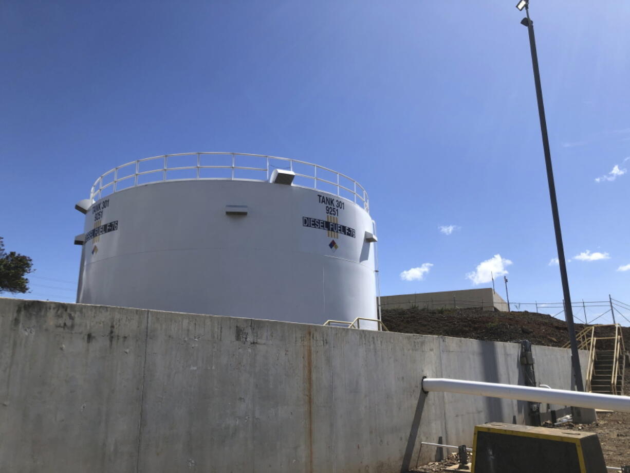 An above-ground fuel storage tank stands at Joint Base Pearl Harbor-Hickam on Monday, Oct. 24, 2022. The U.S. military says it's ready to begin draining fuel from three pipelines as part of an initial step toward closing a World War II-era fuel storage facility that leaked petroleum into Pearl Harbor's tap water last year.