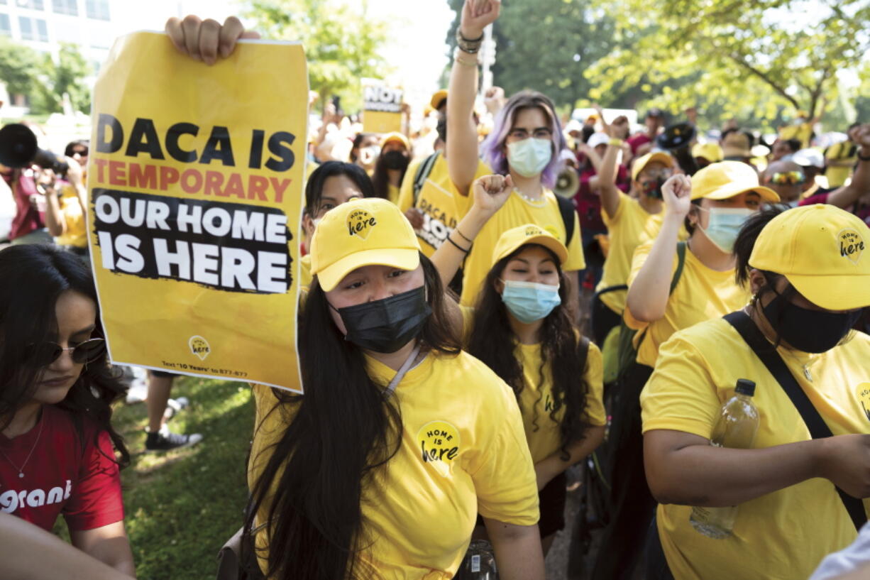 FILE - Susana Lujano, left, a dreamer from Mexico who lives in Houston, joins other activists to rally in support of the Deferred Action for Childhood Arrivals program, also known as DACA, at the U.S. Capitol in Washington on June 15, 2022. The fate of DACA, a program preventing the deportation of hundreds of thousands of immigrants brought into the United States as children, was set Friday, Oct. 14, 2022, to again be in front of a federal judge who has previously declared it illegal. (AP Photo/J.