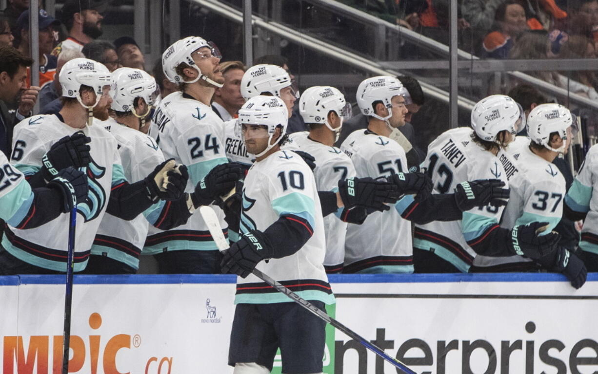 Seattle Kraken's Matty Beniers (10) celebrates a goal against the Edmonton Oilers during the second period of an NHL hockey preseason game Friday, Oct. 7, 2022, in Edmonton, Alberta.