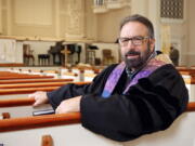 Pastor Mike Usey sits Sept. 25 in the pews of College Park Baptist Church in Greensboro, N.C.