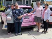 From left: Lucy Beltran, Esthela Cazarez, Susan Stearns and Margarita Jimenez Pacheco stand by the bright pink car sponsored by Vancouver Toyota for Pink Lemonade Project. The women met for the first time in August after participating in a Latina support group for Spanish speaking patients that met virtually during the pandemic.