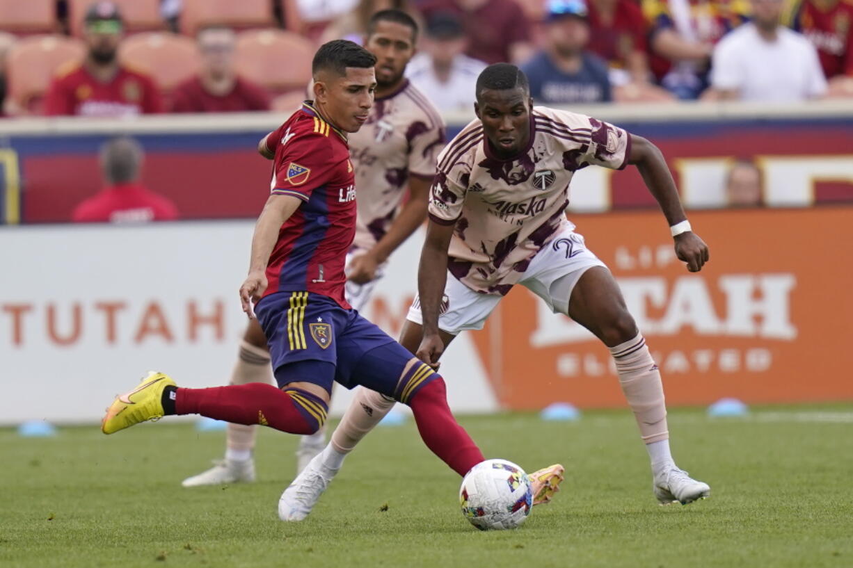 Portland Timbers' Juan Mosquera (29) guards Real Salt Lake forward Jefferson Savarino, left, during the first half of an MLS soccer match Sunday, Oct. 9, 2022, in Sandy, Utah.