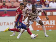 Portland Timbers' Juan Mosquera (29) guards Real Salt Lake forward Jefferson Savarino, left, during the first half of an MLS soccer match Sunday, Oct. 9, 2022, in Sandy, Utah.