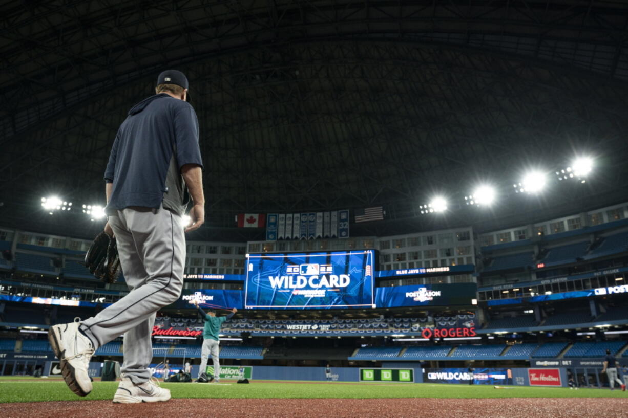 The Seattle Mariners take to the field  during a baseball workout, Thursday, Oct. 6, 2022, in Toronto, ahead of the team's wildcard playoff game against the Toronto Blue Jays.