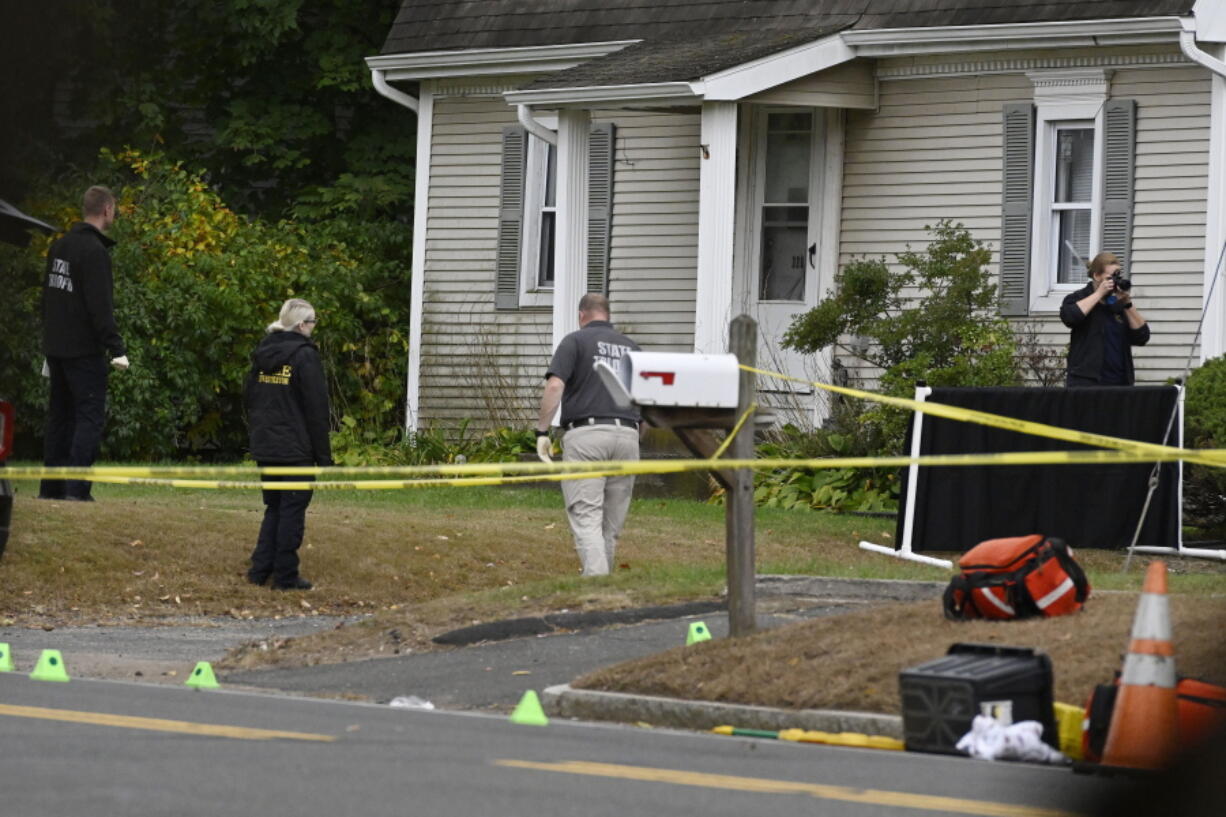 FILE - Police investigate the scene where two police officers were killed the night before in Bristol, Conn., Thursday, Oct. 13, 2022. A segment of footage from a police body camera worn by Officer Alec Iurato was released Sunday, Oct.