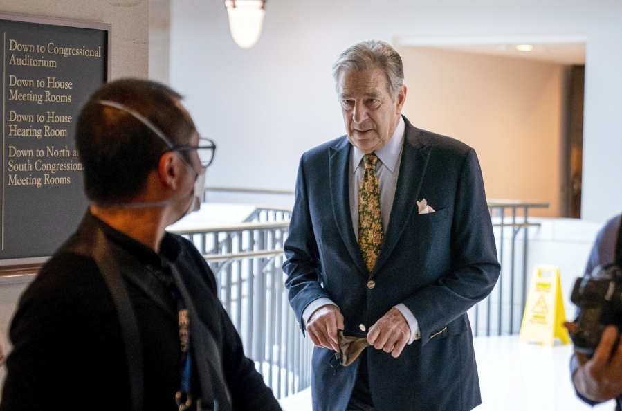 FILE - Paul Pelosi, right, the husband of House Speaker Nancy Pelosi, of California, follows his wife as she arrives for her weekly news conference on Capitol Hill in Washington on March 17, 2022. House Speaker Nancy Pelosi's husband, Paul, was "violently assaulted" by an assailant who broke into their San Francisco home early Friday, Oct. 28, 2022, and he is now in the hospital and expected to make a full recovery, said her spokesman, Drew Hammill.