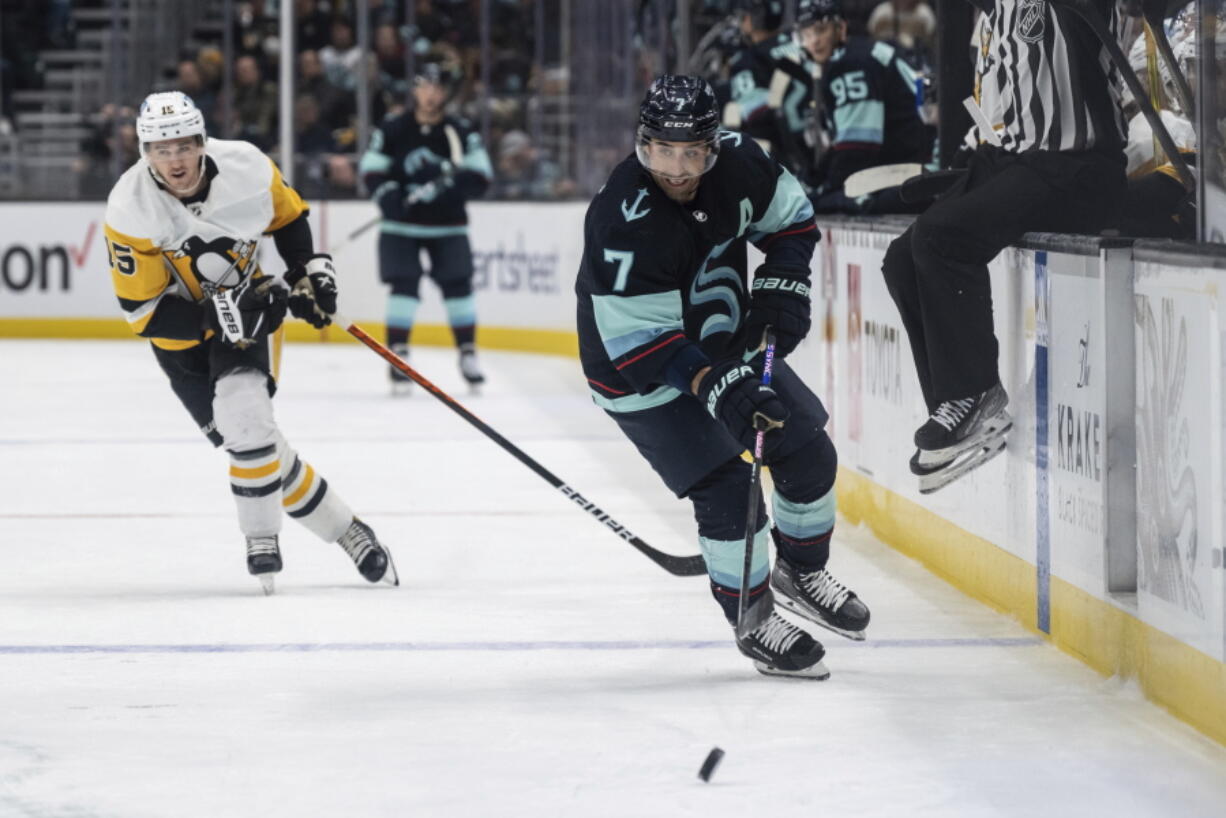 Seattle Kraken forward Jordan Eberle, right, skates against Pittsburgh Penguins forward Josh Archibald during the first period of an NHL hockey game, Saturday, Oct. 29, 2022, in Seattle. The Kraken won 3-1.