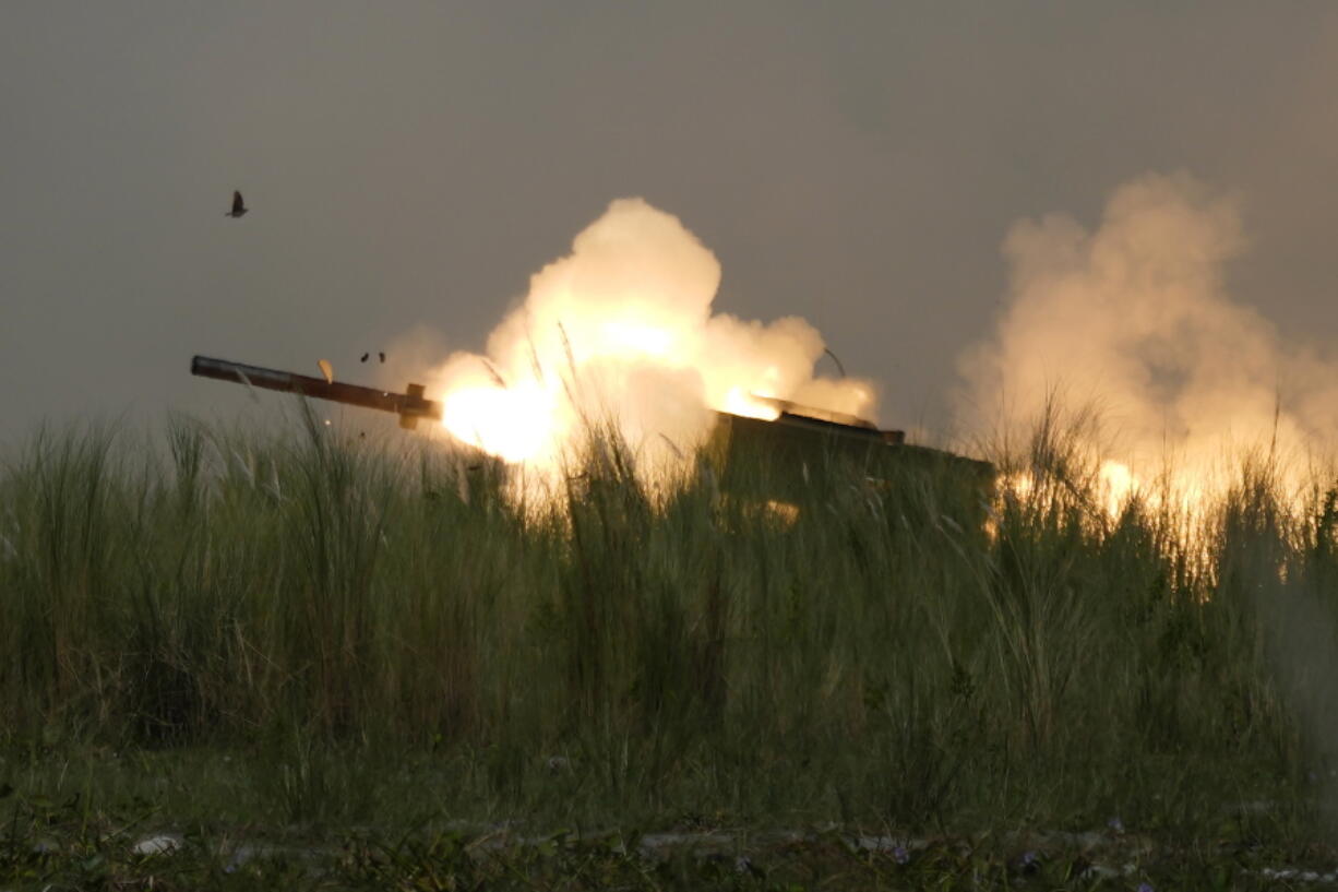 A U.S. M142 High Mobility Artillery Rocket System (HIMARS) fires a missile during annual combat drills between the Philippine Marine Corps and U.S. Marine Corps in Capas, Tarlac province, northern Philippines, Thursday, Oct. 13, 2022. Truck-mounted launchers blasted off rockets Thursday and U.S. stealth fighter jets streaked across the northern Philippine sky in a combat drill and latest display of American firepower in a region where Washington has tried to deter what it warns as China's growing aggression.