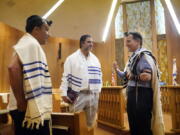 Rabbi David Wolpe, right, speaks to congregants at Sinai Temple on Sept. 23 in Los Angeles.