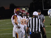 Prairie's Kaleb Watson (56) makes the call on the opening coin toss before the Falcons' game at Corvallis, Ore., on Friday, Oct. 14, 2022.