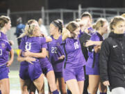 Columbia River girls soccer players celebrate their 2-1 win over Ridgefield on Tuesday, Oct. 4, 2022.