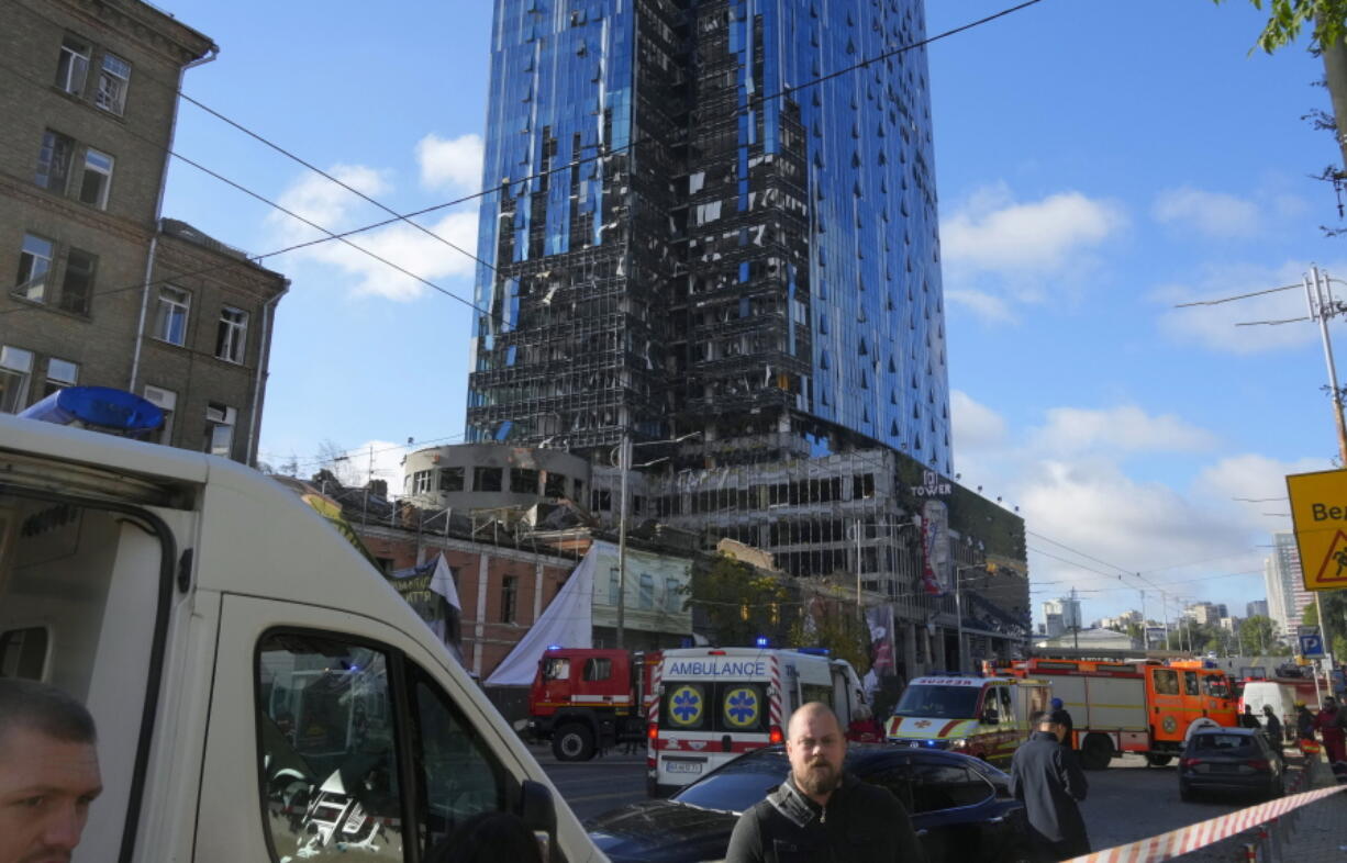 Police block the scene of Russian shelling in Kyiv, Ukraine, Monday, Oct. 10, 2022. Two explosions rocked Kyiv early Monday following months of relative calm in the Ukrainian capital.