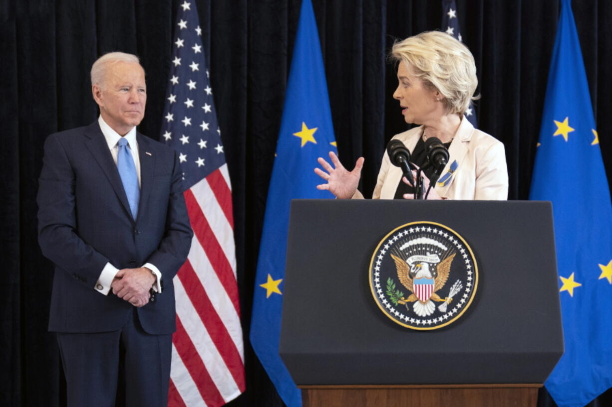 President Joe Biden listens as European Commission President Ursula von der Leyen speaks about the Russian invasion of Ukraine, at the U.S. Mission in Brussels, Friday, March 25, 2022, in Brussels.