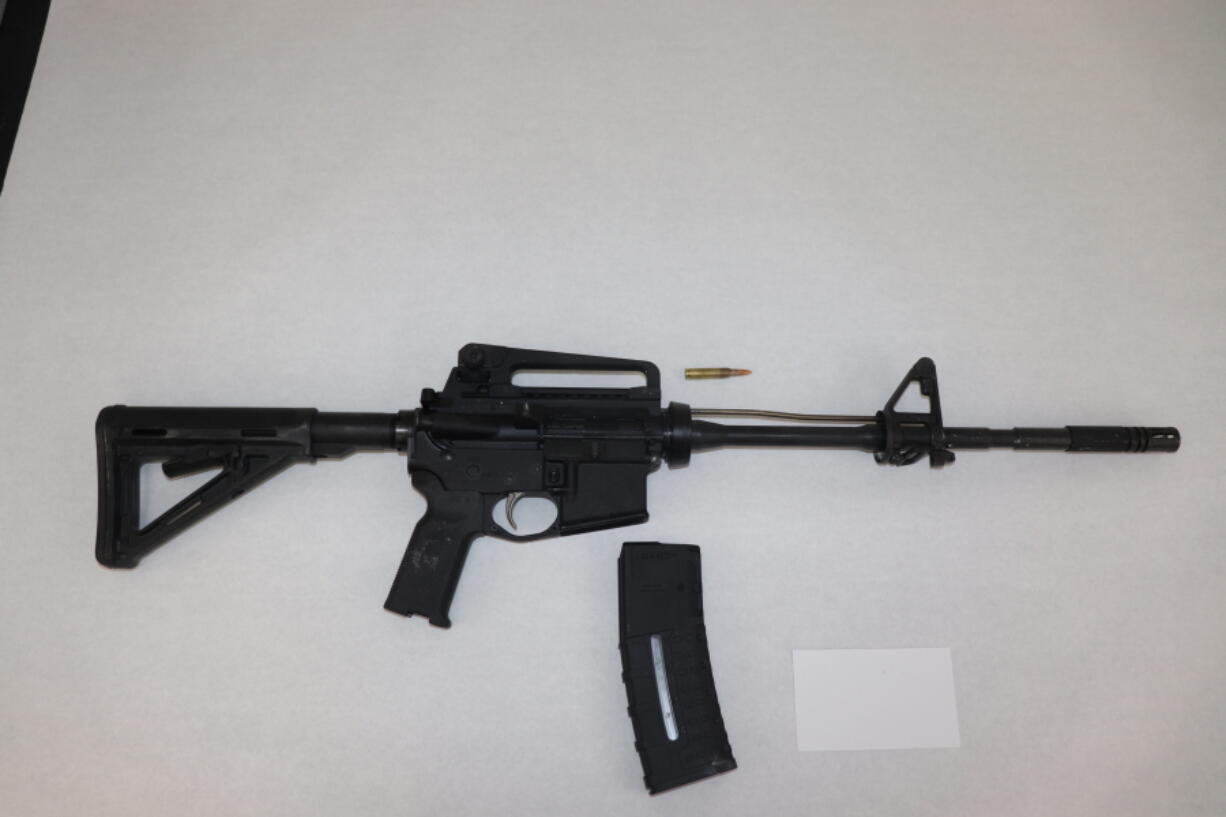 This image provided by the St. Louis Metropolitan Police Department shows an AR-15-style rifle used by a 19-year-old gunman who killed a teacher and a 15-year-old girl at a St. Louis high school on Monday, Oct. 24, 2022. The gunman was armed with an AR-15-style rifle and what appeared to be more than 600 rounds of ammunition, Police Commissioner Michael Sack said Tuesday, Oct. 25, 2022. (St.