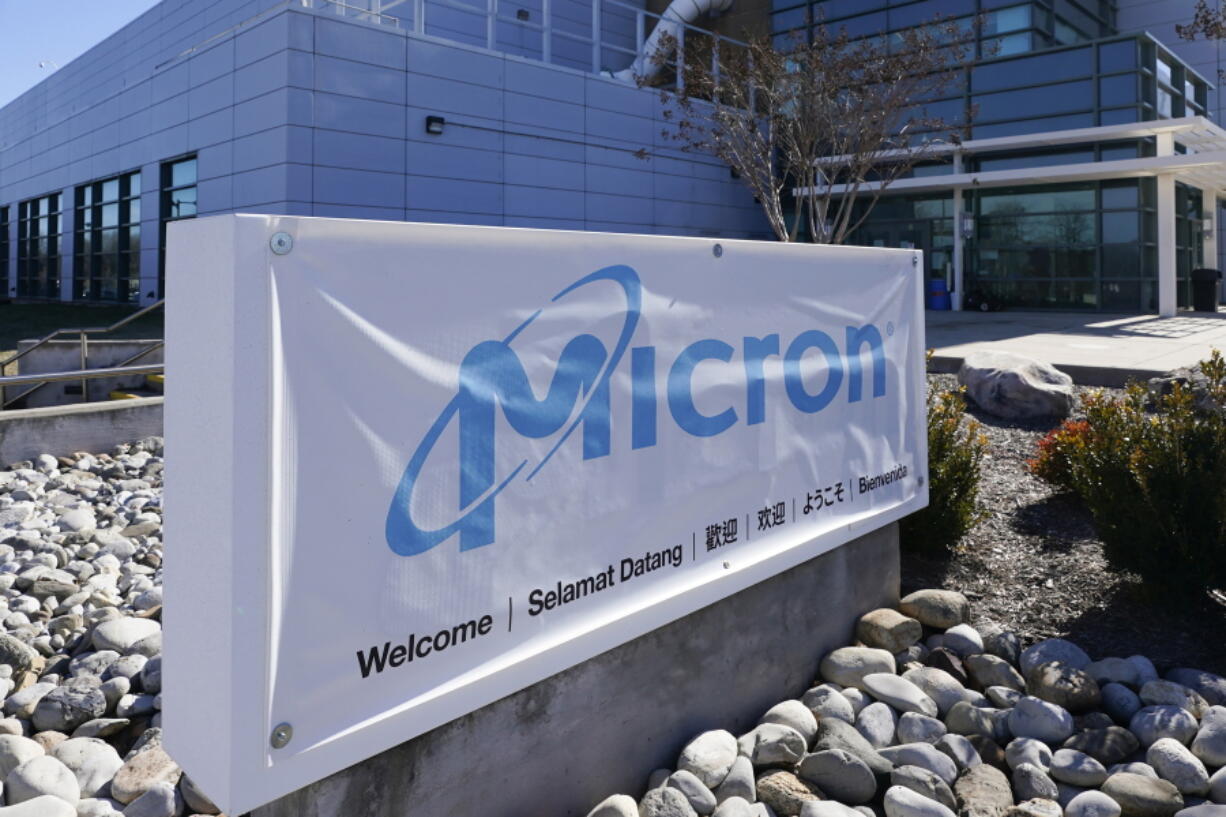 FILE - A sign marks the entrance of the Micron Technology automotive chip manufacturing plant on Feb. 11, 2022, in Manassas, Va. Micron, one of the world's largest microchip manufacturers, is expected to open a semiconductor plant in New York, promising a $100 billion investment and a plant that could bring 50,000 jobs to the state. Senate Majority Leader Charles Schumer confirmed the company's plan to The Associated Press after speaking to its leaders.