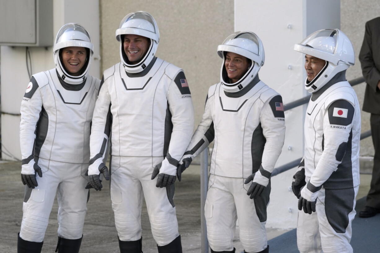 SpaceX Crew5 astronauts, from left, Russian cosmonaut Anna Kikina, NASA astronaut Josh Cassada, NASA astronaut Nicole Mann and Japan Aerospace Exploration Agency astronaut Koichi Wakata pose for a photo as they leave the Operations and Checkout building before heading to Launch Pad 39-A at the Kennedy Space Center in Cape Canaveral, Fla., for a mission to the International Space Station Wednesday, Oct. 5, 2022.